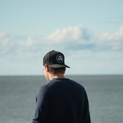 The black baseball cap