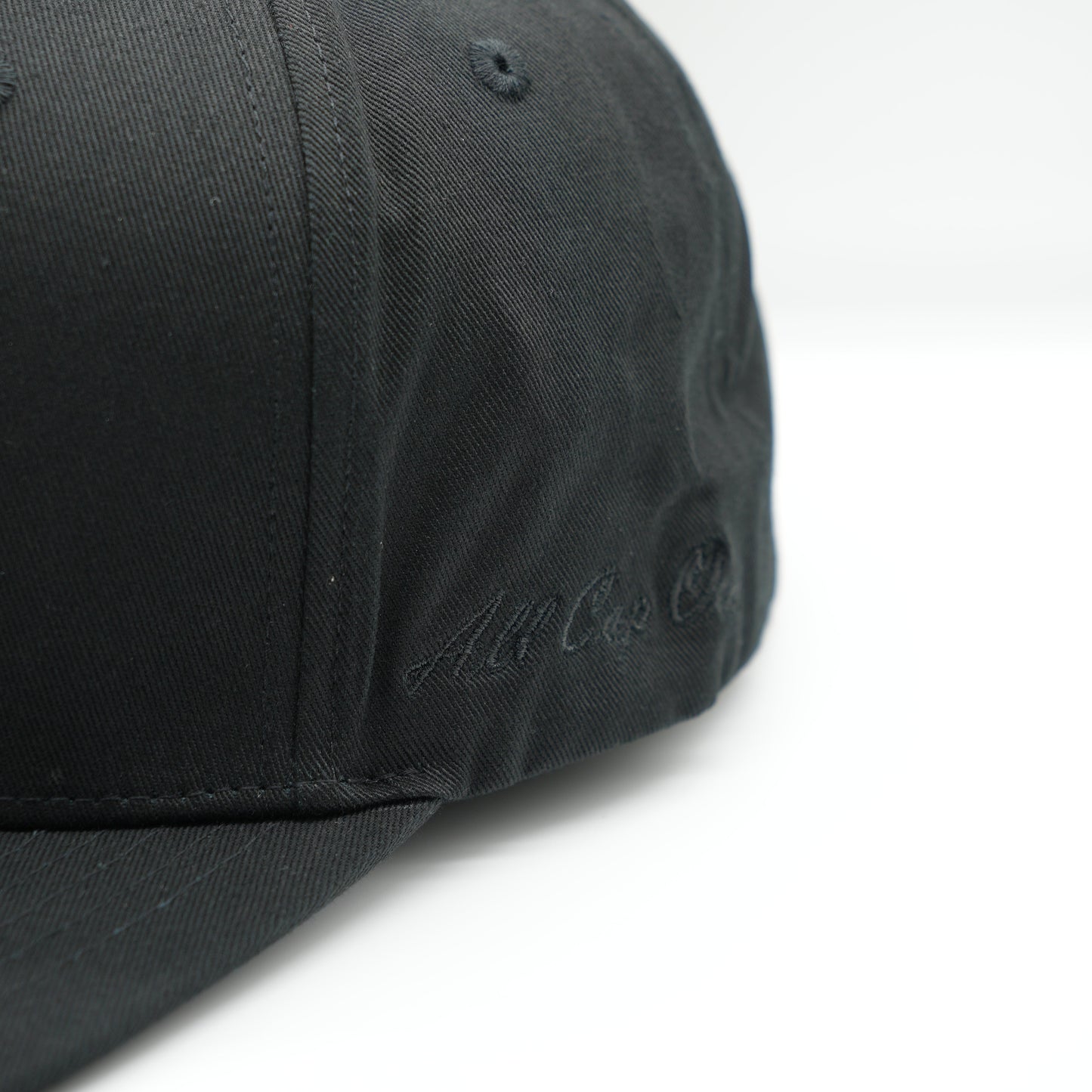 The black baseball cap