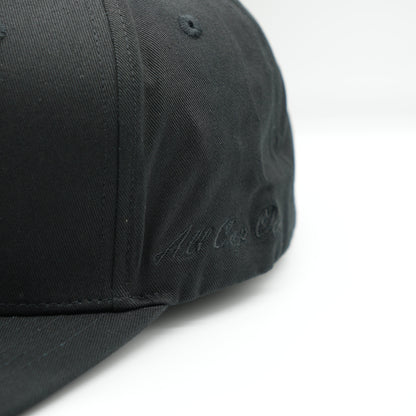 The black baseball cap